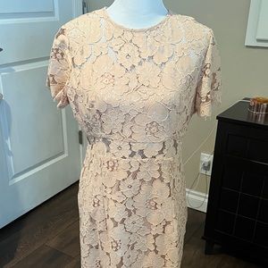 Women’s cream colored lace dress.